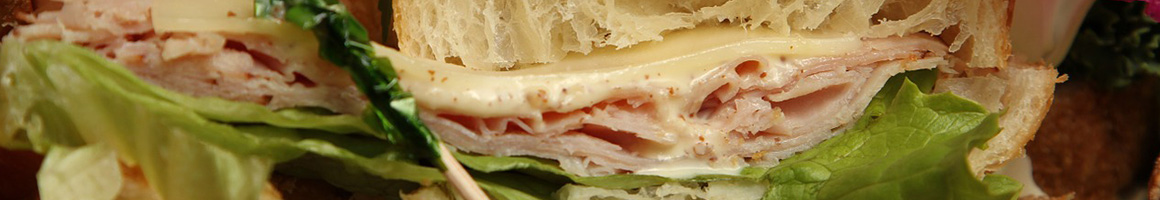 Eating Barbeque Deli Pizza Sandwich at Smokehaus Pizza and Pints restaurant in Redding, CA.